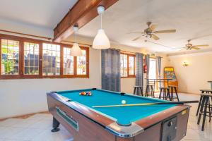 a pool table in a living room with a ceiling at Hotel Antares in Cala d´Or