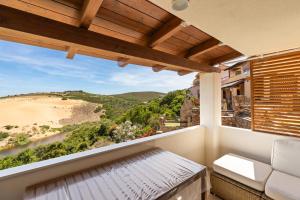 a balcony with a view of a beach at Sabbiamare Torre dei Corsari in Torre Dei Corsari