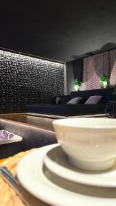 a white bowl sitting on top of a table at MIRAGE47SPA - Private Spa Suite with Jacuzzi & Sauna in Marbella in Marbella