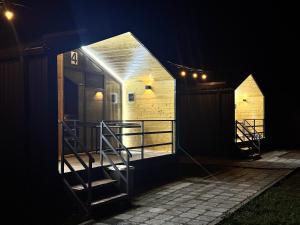 a tiny house is lit up at night at Tosor Barnhouse in Tossor