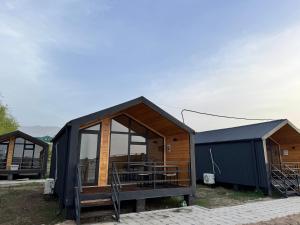 a modular house with glass doors and windows at Tosor Barnhouse in Tossor