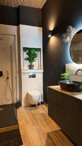 a bathroom with a sink and a toilet at MIRAGE47SPA - Private Spa Suite with Jacuzzi & Sauna in Marbella in Marbella