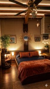 a bedroom with a bed and a ceiling fan at Beach apartment - Ocean sunset full view in Meschers-sur-Gironde