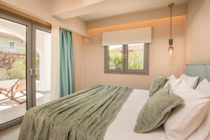 a bedroom with a bed and a window at Sea View in Laganas
