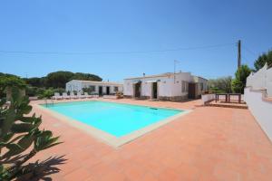 a swimming pool in the backyard of a villa at Cavagrande Guest House in Avola