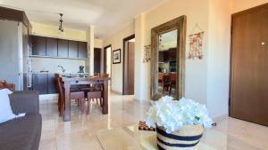 a living room with a kitchen and a dining room at Casa De Sol by Horizon Homes in Ofrínion +9 photos