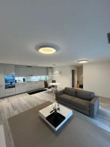 a living room with a couch and a table at Cozy apartment in Zurich