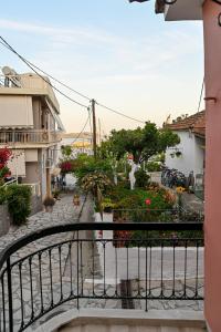 a view of a street from a balcony at BotaniCasa by WENS in Preveza