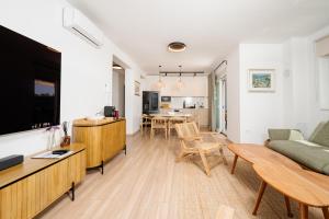 a living room with a couch and a table at Residence Giardino in Ugljan