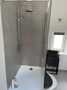 a shower with a glass door in a bathroom at Week end à Spa in Spa +48 photos