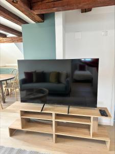 a living room with a couch and a coffee table at Stadtloft Suites Richterswil in Richterswil