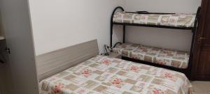 a bedroom with two bunk beds in a room at Casa Vacanze Sofì in Ascea