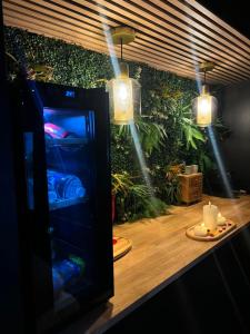 a vending machine on a table with candles and lights at L'écrin Secret Suite & NETFLIX Aubagne-Cassis-Marseille in Aubagne