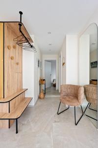 a living room with a table and a chair at Appartment SPATZENNEST in Bietigheim-Bissingen