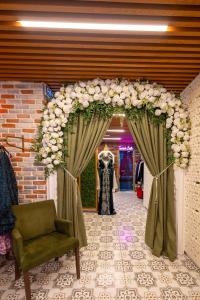 an entrance to a dressing room with an arch with flowers at Poison Garden Suite & SPA in Gözalan +197 photos