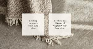 two white signs sitting on top of a pile of rope at Falkensteiner Resort Lake Garda in Salò +35 photos