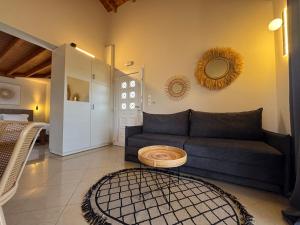 a living room with a couch and a table at Mersea deluxe apartment Kourouta in Kourouta