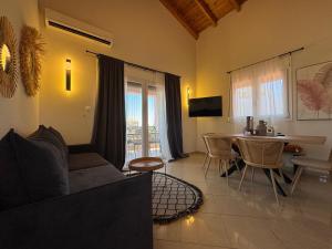 a living room with a couch and a table at Mersea deluxe apartment Kourouta in Kourouta