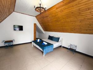 a bedroom with a bed with a wooden ceiling at Relax Beach Astara in Astara