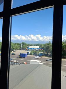 a view from a window of a parking lot at Hotel Mardin in Almaty