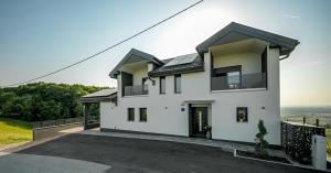 a white house with black roof at Northern Croatia Accessible Luxury Villa in Cestica
