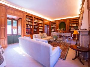 a living room with a couch and a table at Cortijo Negretti in Herrera de Alcántara