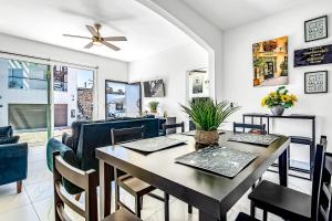 a dining room with a table and chairs at Dog-friendly home 3 rows to beach with rooftop deck, pool, hot tub, & kitchen in Rosarito