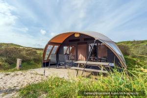a tent on the beach in a field at Texelcampings - Kogerstrand in De Koog