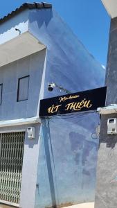 a sign on the side of a building at Minihouse Út Thiểu in Rạch Giá