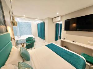 a hospital room with a bed and a flat screen tv at Seven Paddington in London