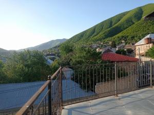 a balcony with a view of a mountain at Sheki Ev Guest House in Sheki
