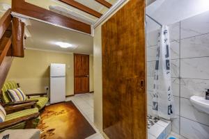 a living room with a couch and a sink at The 196 City Lodge in Pretoria +62 photos