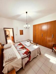 a bedroom with a large bed and a mirror at Casa bea in Taranto