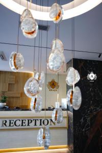a bunch of glass spheres hanging from a ceiling at Hotel Kraja in Golem +104 photos