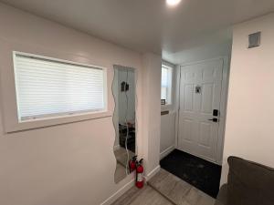 a bathroom with a shower in the corner of a room at Silverado Suite Modern Quiet 2BR Queen's Downtown in Kingston