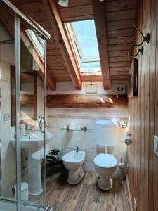 a bathroom with a toilet and a sink at B&B Marcellina in Bard