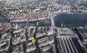 an aerial view of a city with a river and a bridge at Hotel Central Luzern in Luzern