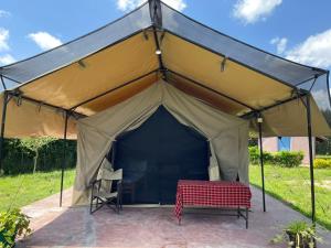 a tent with a chair and a table in it at Treasure camp in Maasai Mara National Reserve