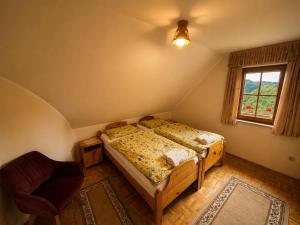 a bedroom with a bed and a window at Zidanica Jakec Wine House & Scenic Views in Podlehnik