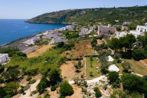 an aerial view of a village next to the ocean at Tende Glamping Vista Mare Marina Serra in Marina Serra