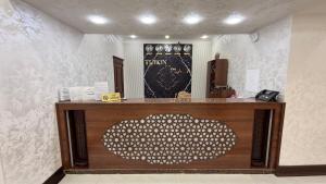 a store with a counter with a heart on it at Turon plaza hotel in Bukhara