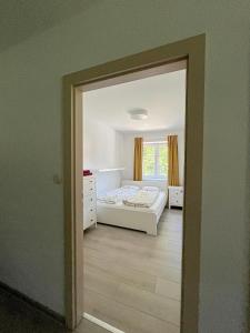a bedroom with a bed and a window at Apartmán Proseč-Obořiště in Nová Cerekev