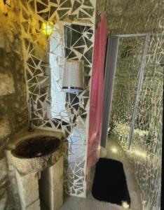 a bathroom with a toilet and a window with a lamp at Appartamento Centrale Apeneste in Vieste