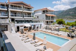 an image of a hotel with a swimming pool at Trizonia Bay Hotel in Trizonia