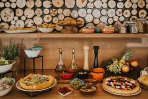 a table topped with lots of different types of food at Hotel Polonez in Krakow