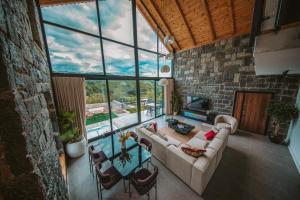 a living room with a couch and a table at Sky Line Villa in Ardeşen