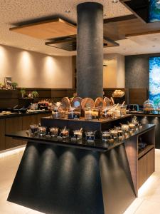 a buffet line with food on display in a restaurant at Terentnerhof 4*S active & lifestyle hotel in Terento