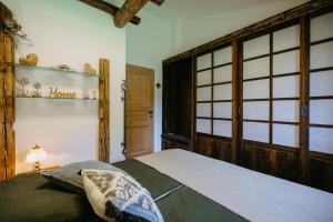 a bedroom with a bed and a window at Ferienhaus Weiss in Oberschützen