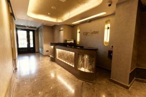 a lobby with a bar in the middle of a building at igman Hotel İstanbul in Istanbul