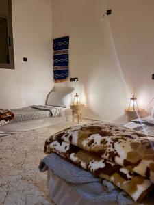 a bedroom with two beds in a room at Surf Apartment in Tamri Rooftop Local Experience in Tamri